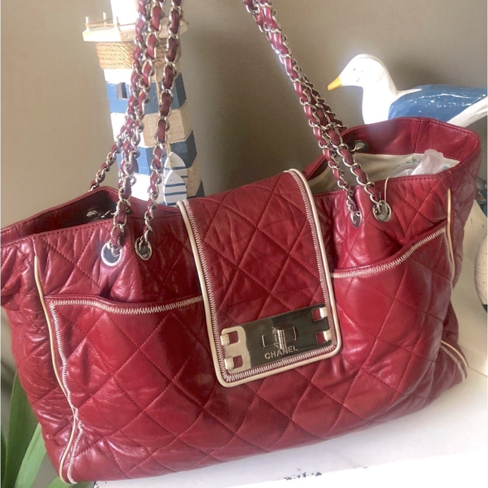 Very large East West Chanel red handbag. Great preowned condition.